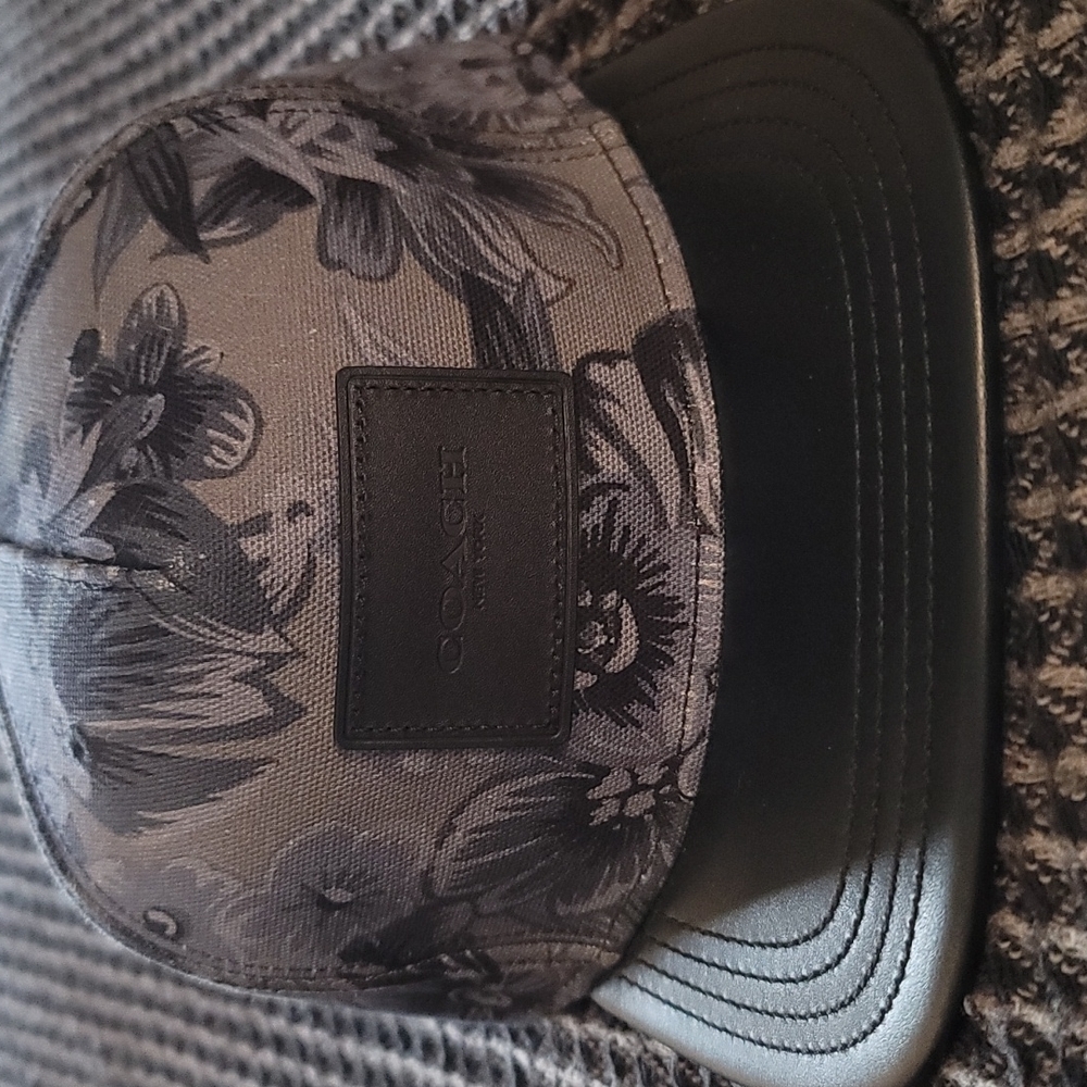 Coach leather rimmed hat.